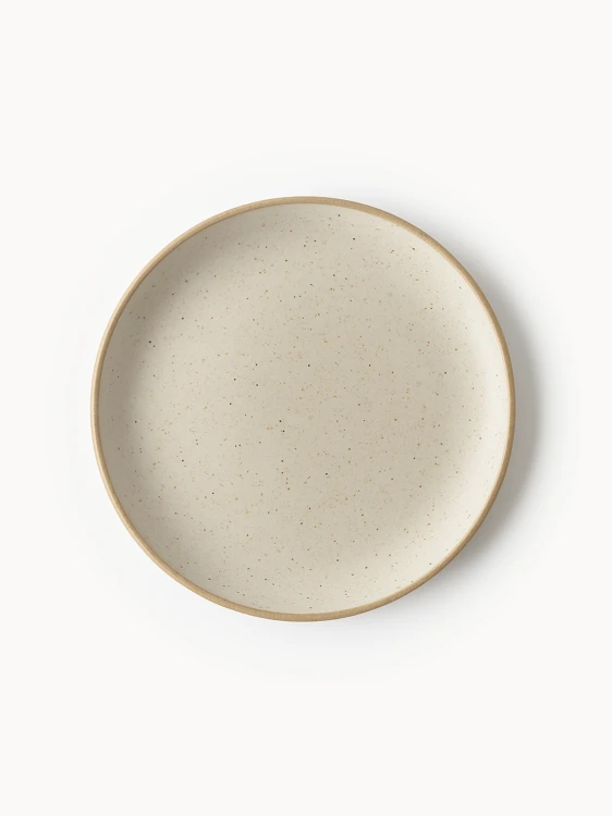 A top-down view of a round stoneware plate featuring a speckled cream finish and a natural brown rim.