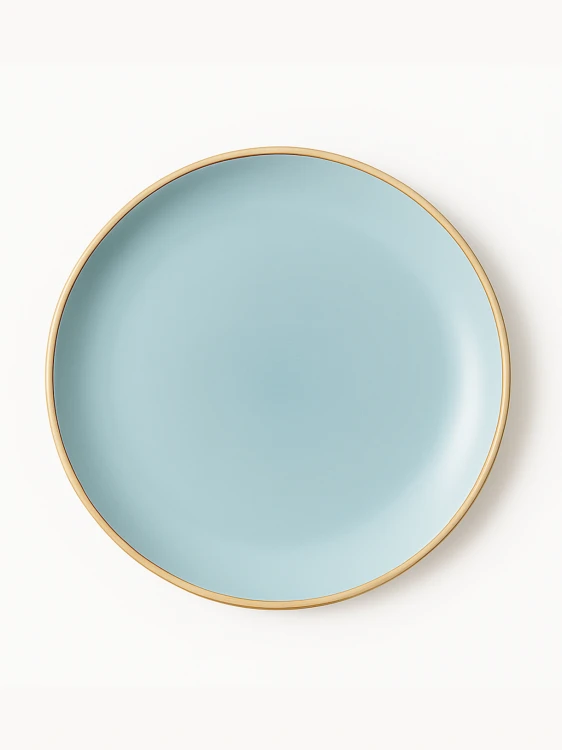 A top-down view of a round ceramic plate featuring a smooth matte finish in light blue with a clean gold rim. The minimalist dish is centered against a solid white background.