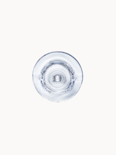 The bottom of a martini glass, viewed from below, reveals the precise geometry of the stable crystal base.